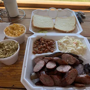 Ribs plus 2 meats (sausage and brisket) with coleslaw, beans, Mac and cheese, and dirty rice. Definitely took a lot home.