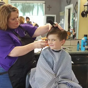 Somerville Style Shop owner Cass cutting Adam&apos;s hair. She&apos;s great with kids, tahdah! Look at the results.