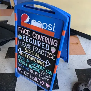 Inside - sign encouraging social distancing