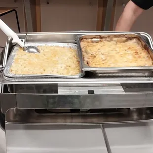 two pans of food being served