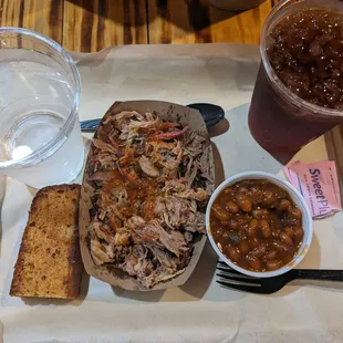 Cornbread, pulled pork, beans, and soda