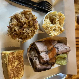 Brisket platter with jambalaya, hash brown casserole, cornbread!