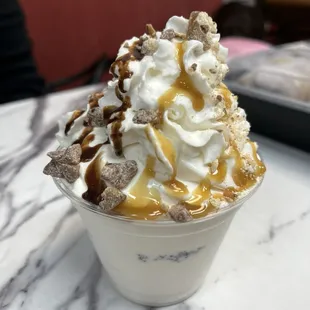 Sundae with chocolate and caramel sauces and Twix bits