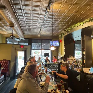 customers sitting at the bar