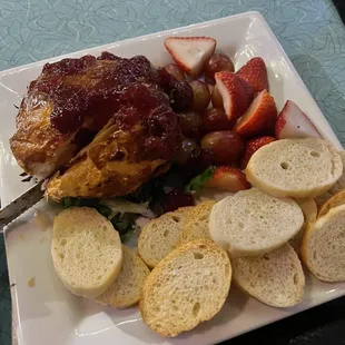 Baked brie with fresh fruit and a cherry sauce