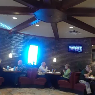 Circular booth seating area located near the entrance.