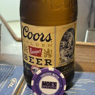 a bottle of beer on a table