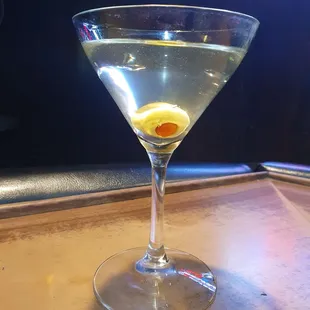 a martini with olives in it