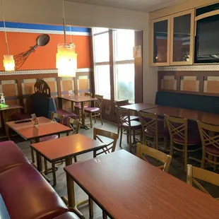 a restaurant with tables and chairs