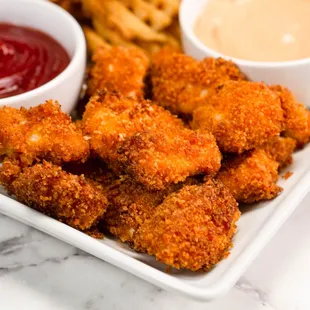 a plate of fried chicken nuggies