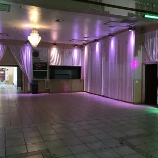 View of the bar and entrance from inside the hall space.