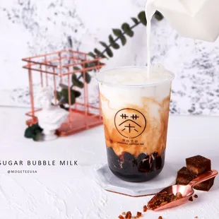 a drink being poured into a glass