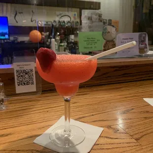 a drink in a glass on a bar