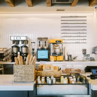 Coffee counter featuring fresh juices and fresh baked bread, squeezed and baked fresh daily in-house!