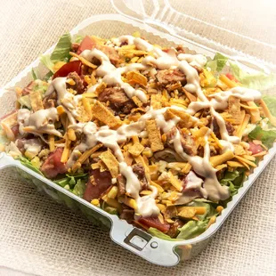 a salad in a plastic container