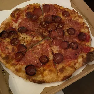 Soppressata and pepperoni with red sauce mozzarella, smoked chili flakes, and tomato to go for $15