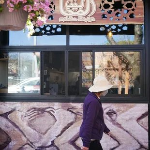 Our outdoor seating is decoured with hanging flower pots.