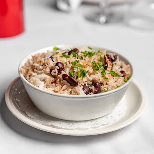 a bowl of rice and beans on a plate