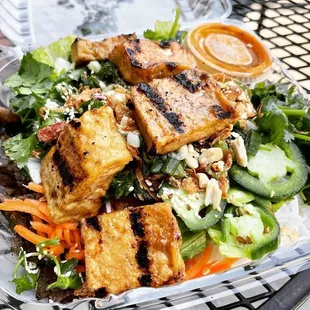 a salad with tofu and vegetables