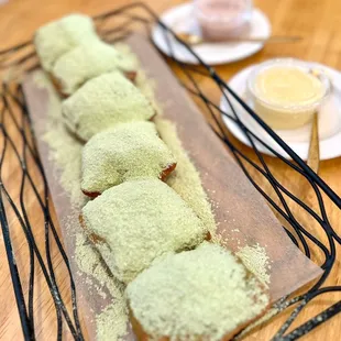 Moignet - dusted with matcha powdered sugar.  Sauces were: strawberry &amp; yuzu.