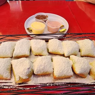 Moignets with 3 dipping sauce (yuzu, chocolate &amp; strawberry). TBH I like them without the sauce.