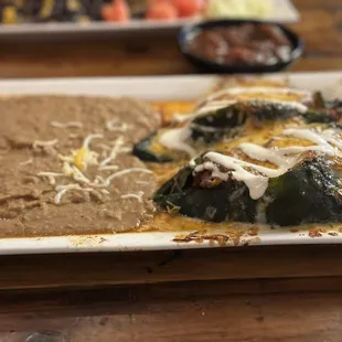 Chile Rellenos with shredded beef-fantastic! Side of beans.