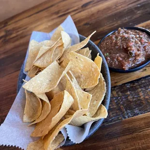 Chips served warm. Salsa is different, with a black peppery taste