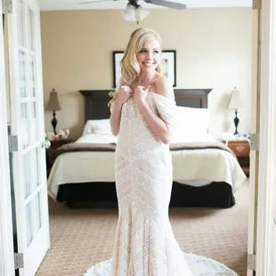 Bride getting her JLynn wedding gown on. In Lawrence KS