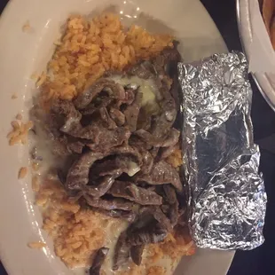 Steven special with Steak! You can resist the overpowering sensation of steak, cheese, and rice! So go and order that Steven special :)