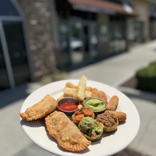 a plate of food on a sidewalk