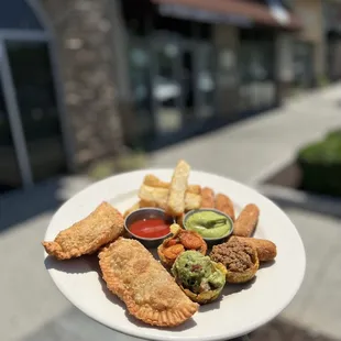 a person holding a plate of food