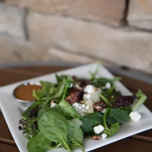 a plate of salad on a table
