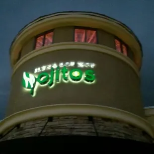 the neon sign on the building