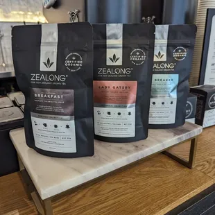 a variety of coffee bags on a counter