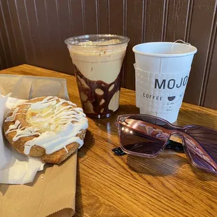 a donut and sunglasses on a table