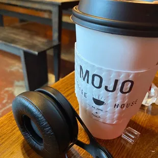 a cup of coffee and headphones