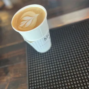a cup of coffee on a bar