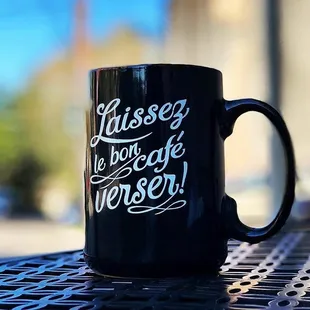 a black coffee mug on a table