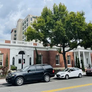 cars parked in front of a building