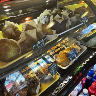 a variety of pastries in a display case