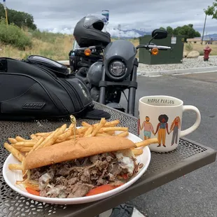 Philly Cheesesteak and Fries.  They serve coffee in real cups.