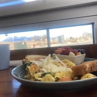 Veggie scramble with fresh fruit.