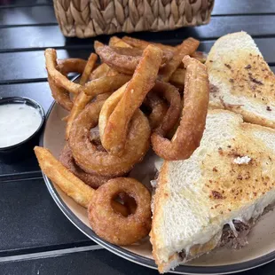 Short rib sandwich fries and onion rings