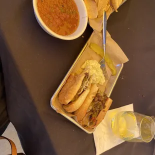 Cheese steak sandwich with provolone, potato salad, pickle spear with a side of chips and salsa. Yummy!!!