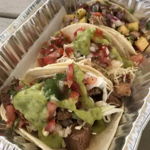 Carne asada, chicken, and carnitas tacos