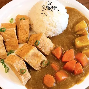 tofu, carrots, and rice on a plate