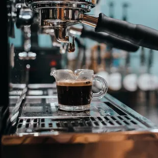 coffee being poured into a cup