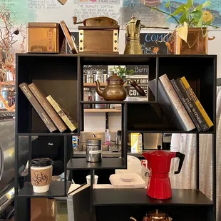 a coffee pot and a coffee pot on a shelf