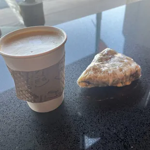 a pastry and a cup of coffee