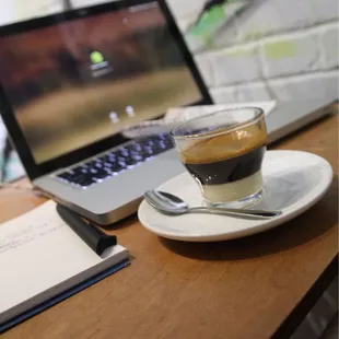 a laptop and a cup of coffee